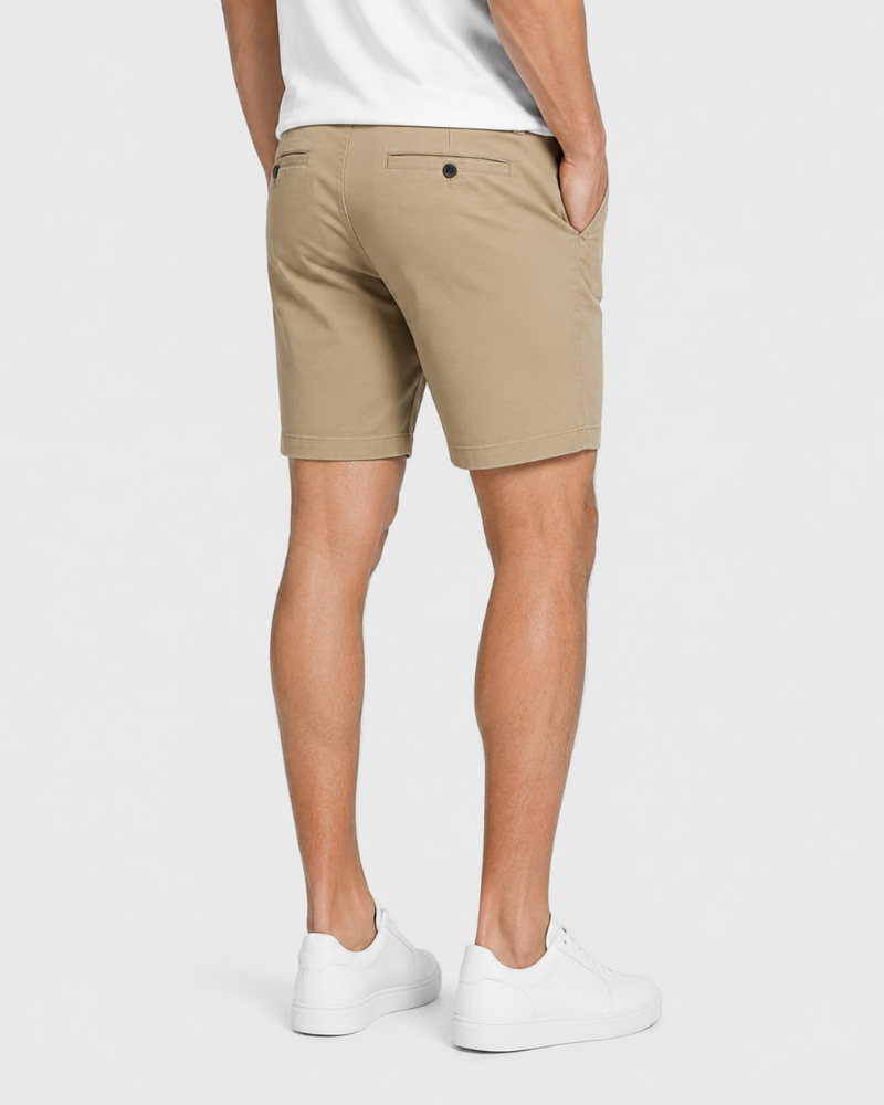Grant Oak beige shorts on male model back view full body light gray background #color_beige