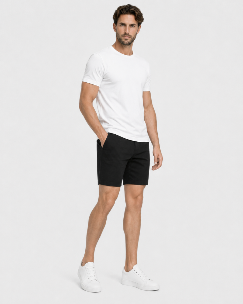 Grant Oak black shorts on male model front angle full body view light gray background #color_black
