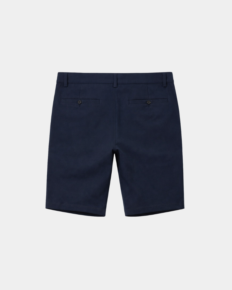 Grant Oak navy shorts flat lay back view light gray background #color_navy