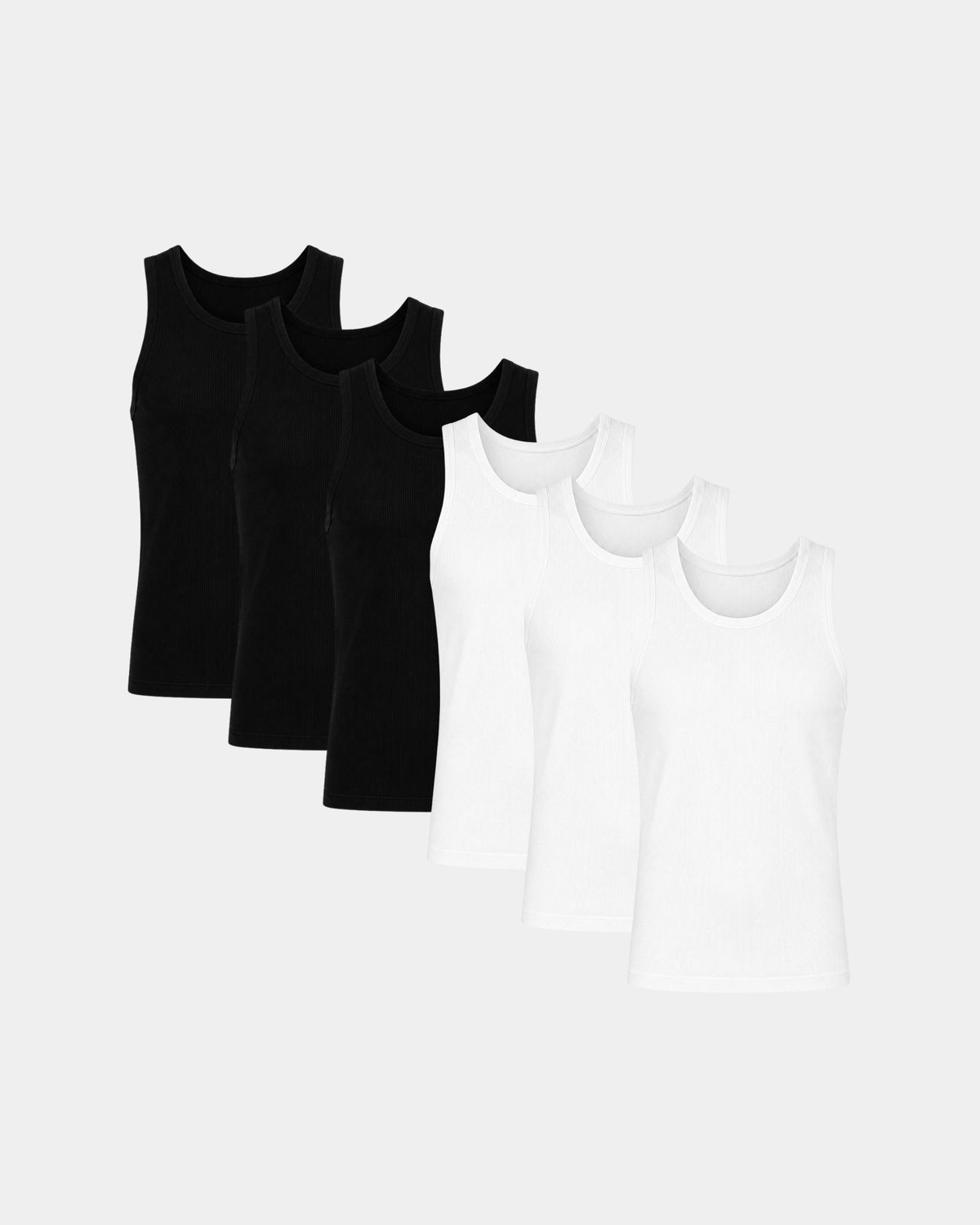 Grant Oak Smart Fit Tank 6-Pack Black & White — five sleeveless tank tops arranged in a fan shape on a light gray background, three black tanks in the back and two white tanks in front.