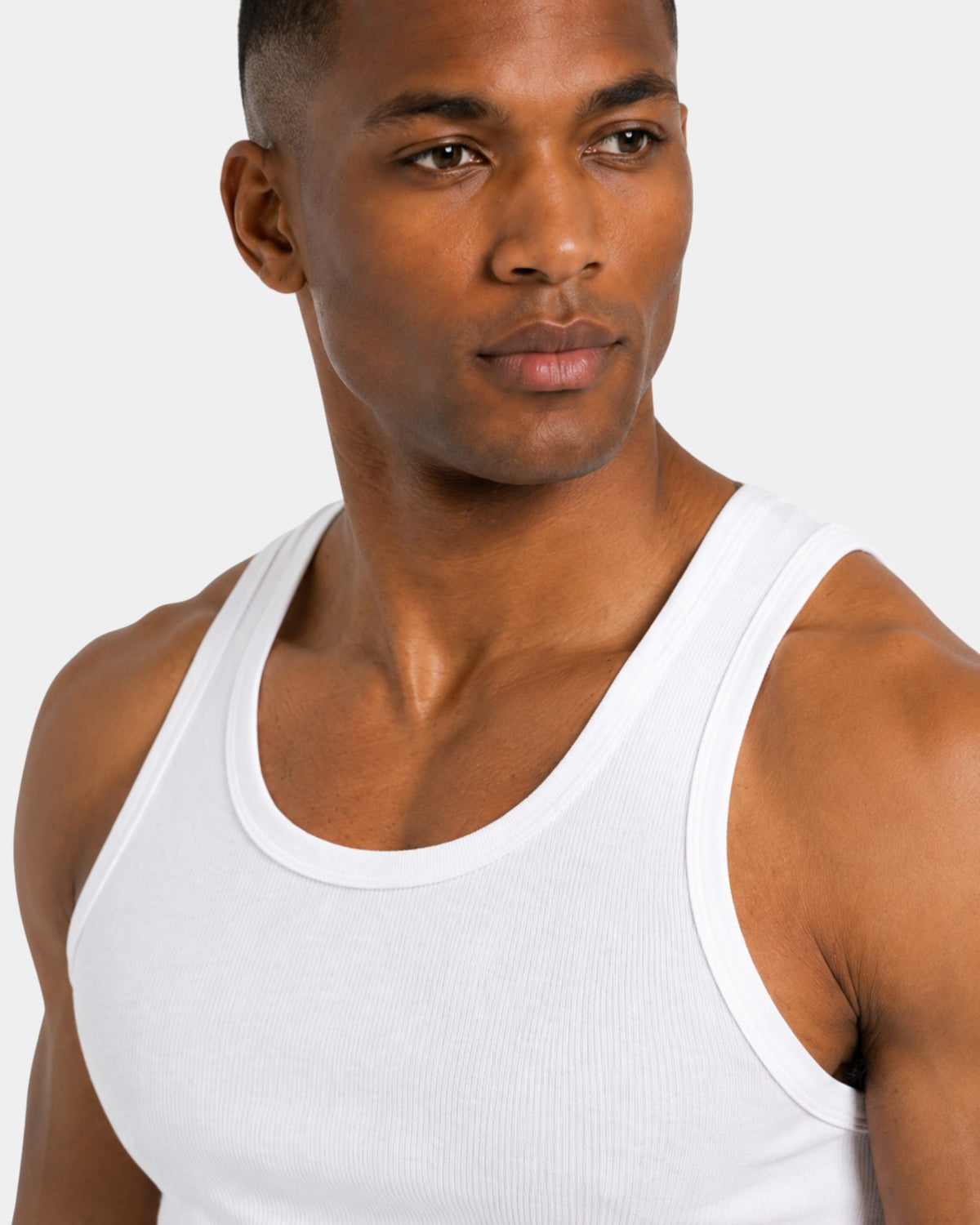 Grant Oak white ribbed tank top on male model, close-up detail of neckline and shoulder, light gray background #Color_white