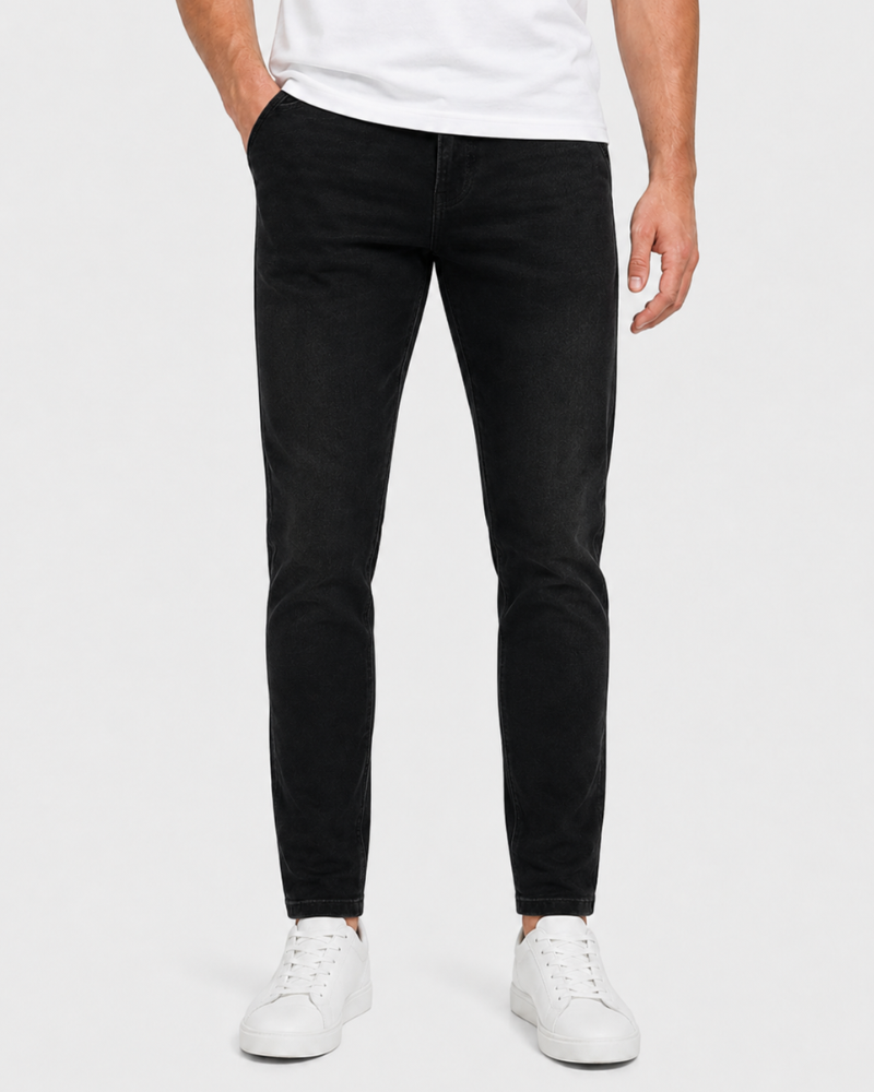 Grant Oak black slim fit jeans worn by a male model, cropped front view, white background #Color_black
