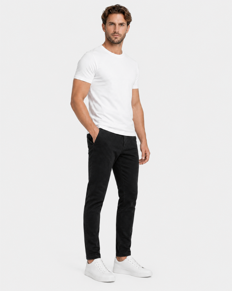 Grant Oak black slim fit jeans worn by a male model, full front angle view, light grey background #Color_black