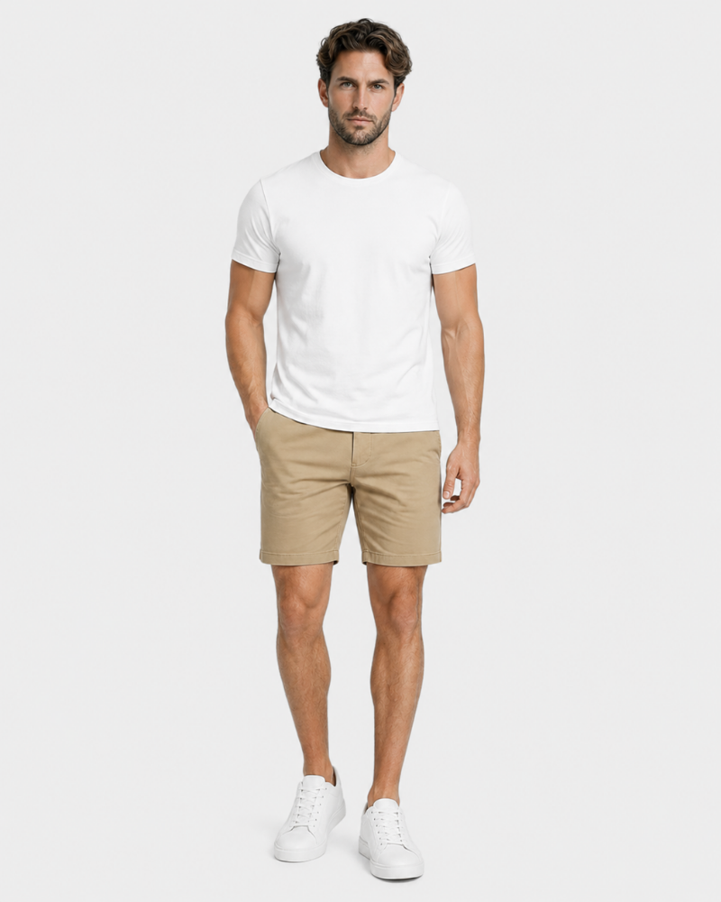 Grant Oak beige shorts on male model front view full body light gray background #color_beige