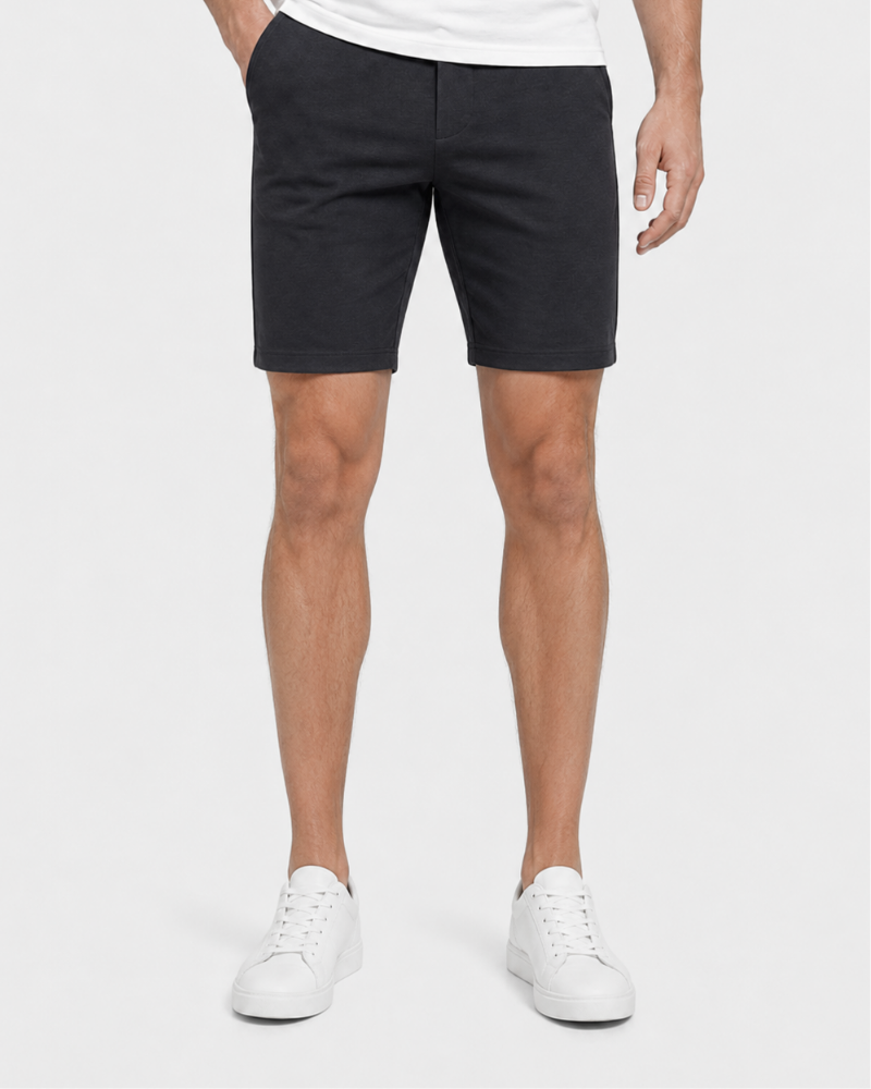 Person wearing Grant Oak gray shorts and white sneakers on a white background #Color_gray
