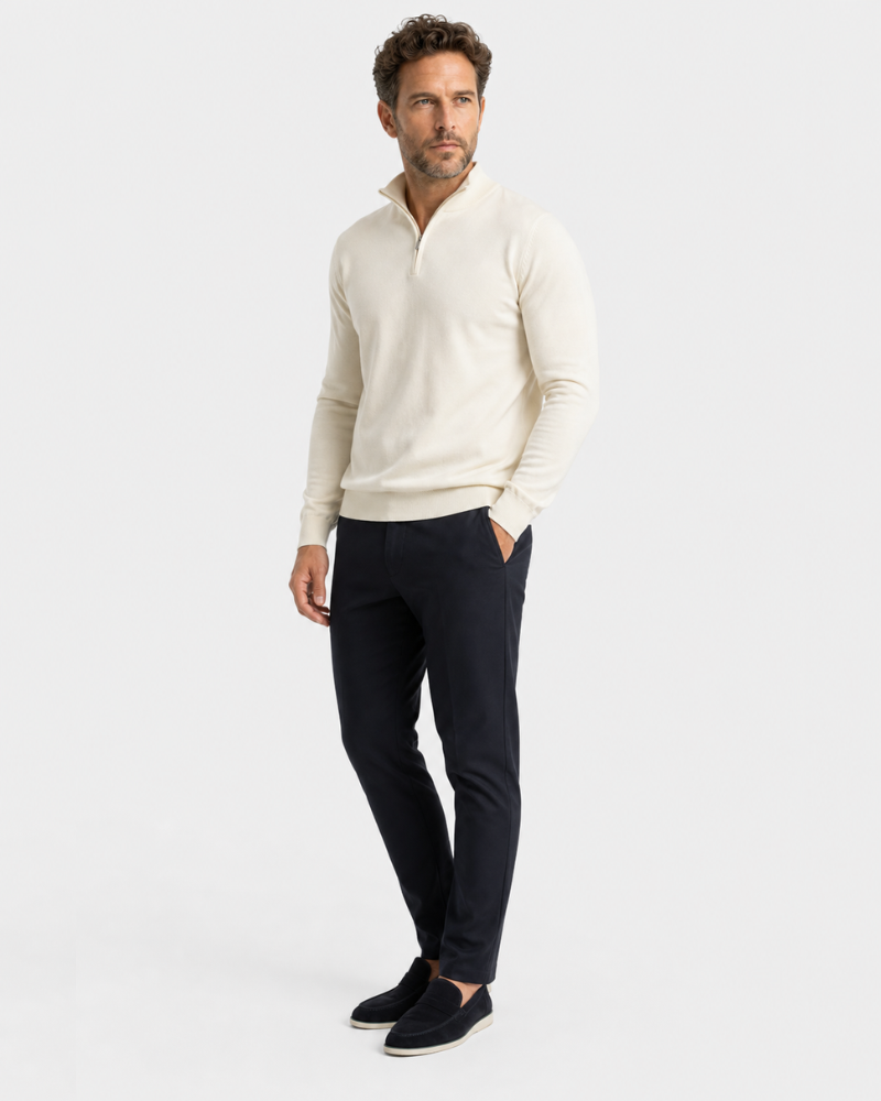 Man wearing a Grant Oak beige sweater and black pants on a white background #color_beige