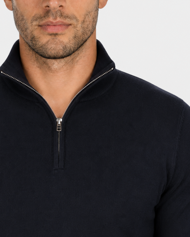 Grant Oak black half-zip knit sweater zipper detail, male model, front close-up, light gray background. #Color_black