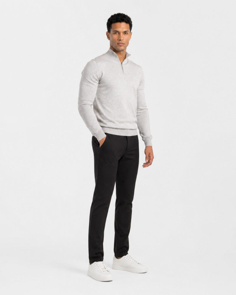 Man wearing a Grant Oak gray sweater and black pants on a white background #color_gray