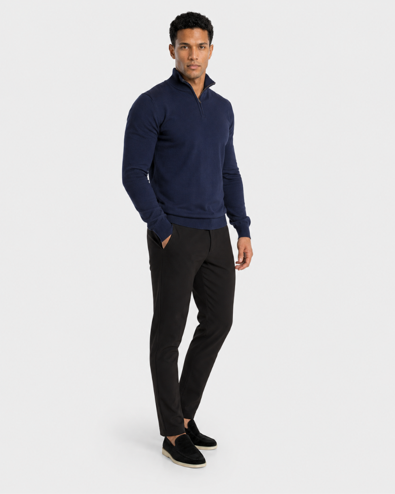 Man wearing a Grant Oak navy sweater and black pants on a white background #color_navy