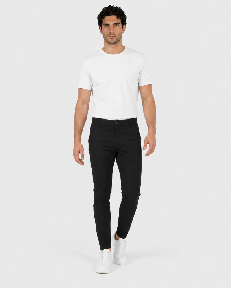 Grant Oak black lightweight stretch chinos in a slim tailored fit, walking view #color_black