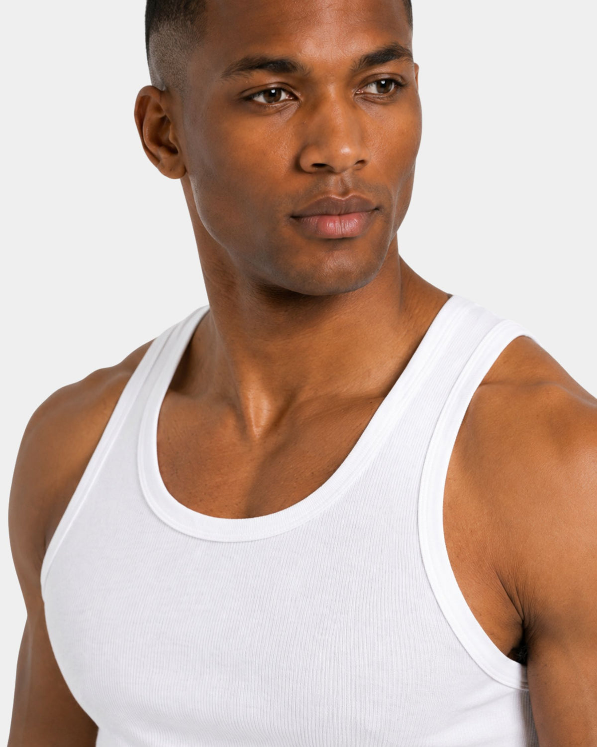 Grant Oak Smart Fit Tank 6-Pack All White — man wearing a white tank top against a plain background.