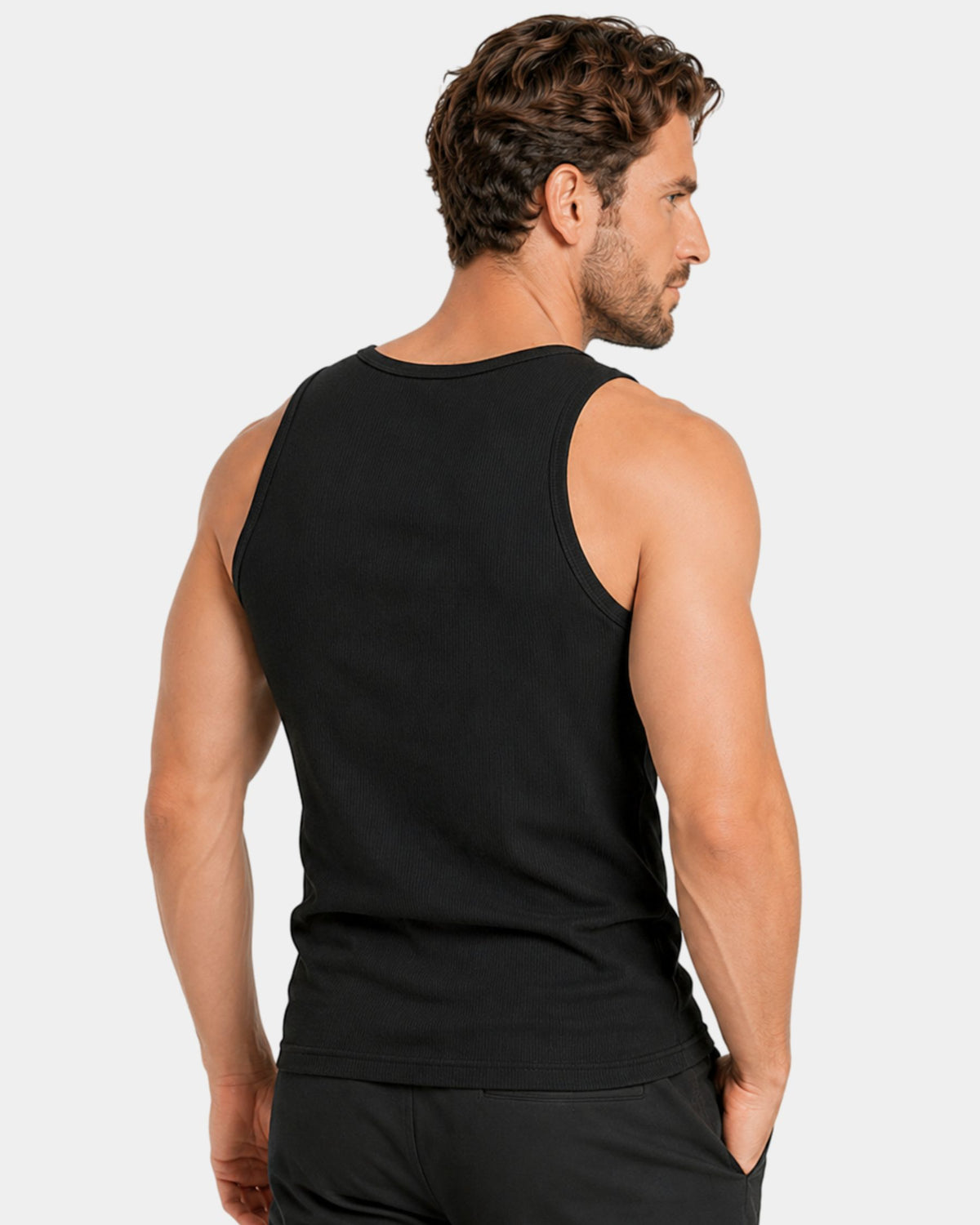 Grant Oak Smart Fit Tank 6-Pack Black & White — man shown from the back wearing a black sleeveless tank top against a light gray studio background.
