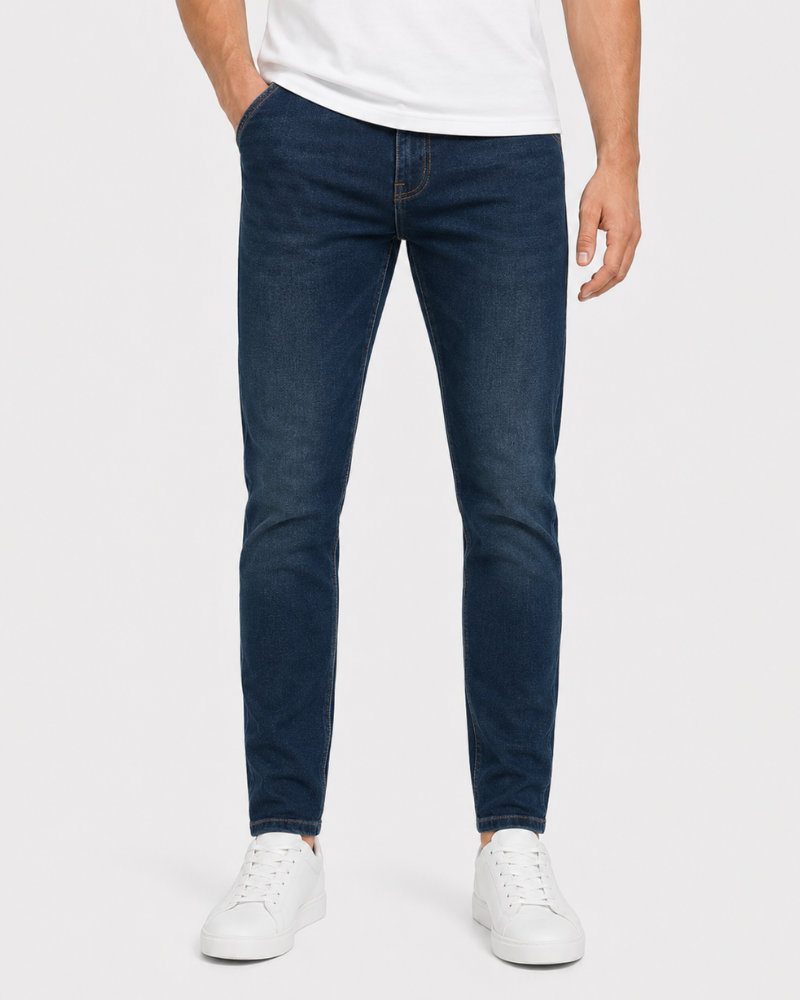 Grant Oak navy slim fit jeans worn by a male model, cropped front view, white background #Color_navy