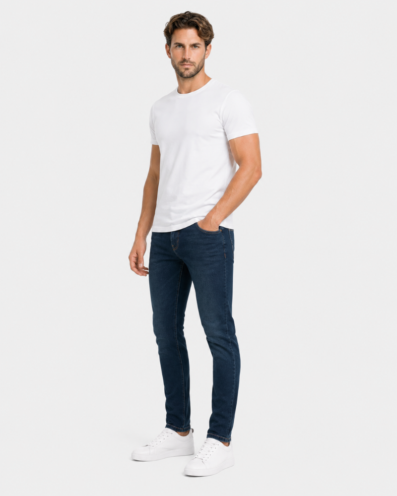 Grant Oak navy slim fit jeans worn by a male model, full front angle view, light grey background #Color_navy